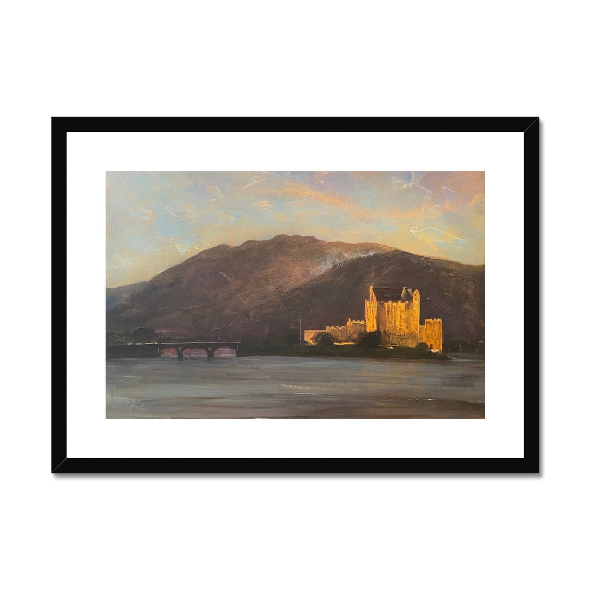 Eilean Donan Castle framed and mounted print featuring a castle on a lake at sunset