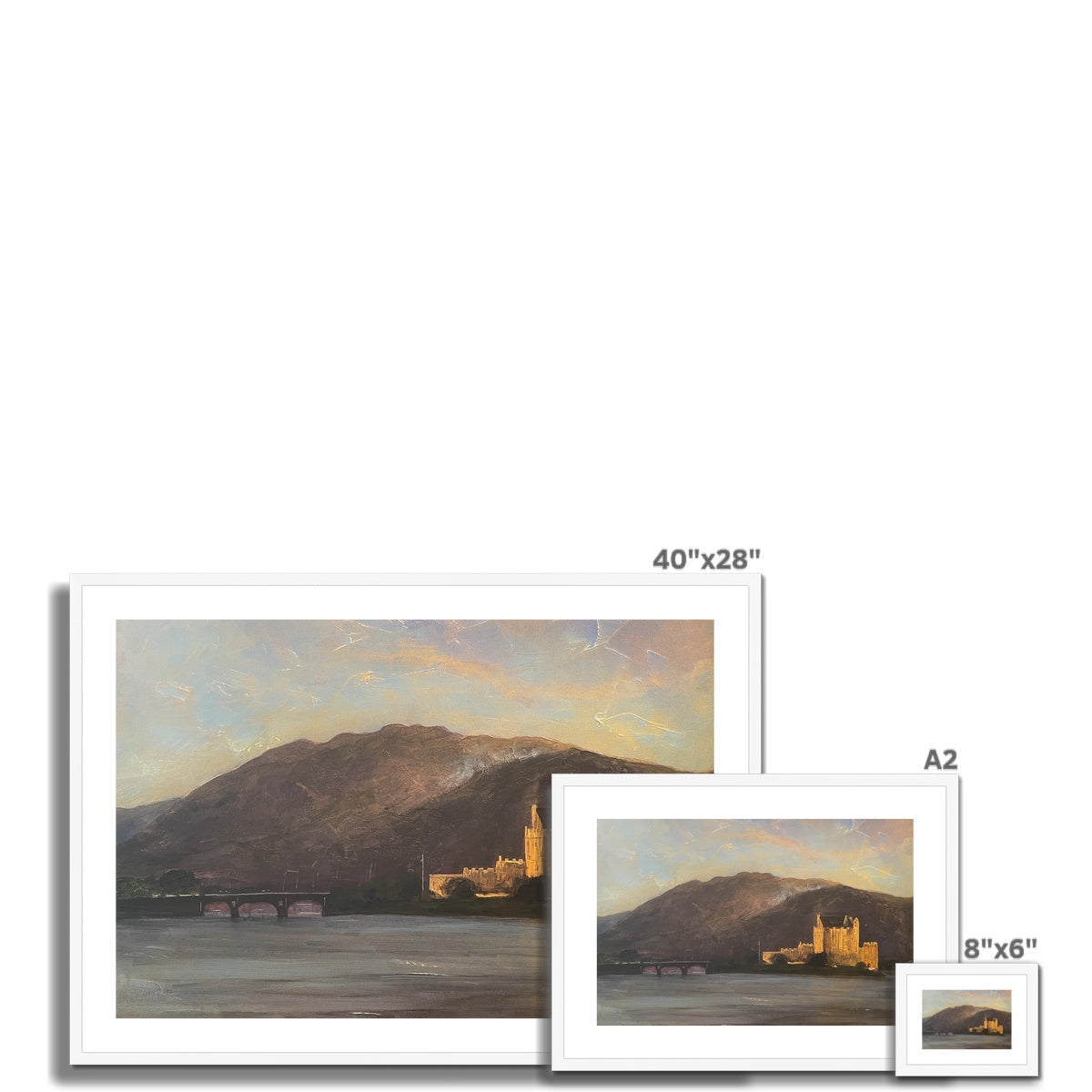 Three framed landscape prints of Eilean Donan Castle by a lake with mountains in the background