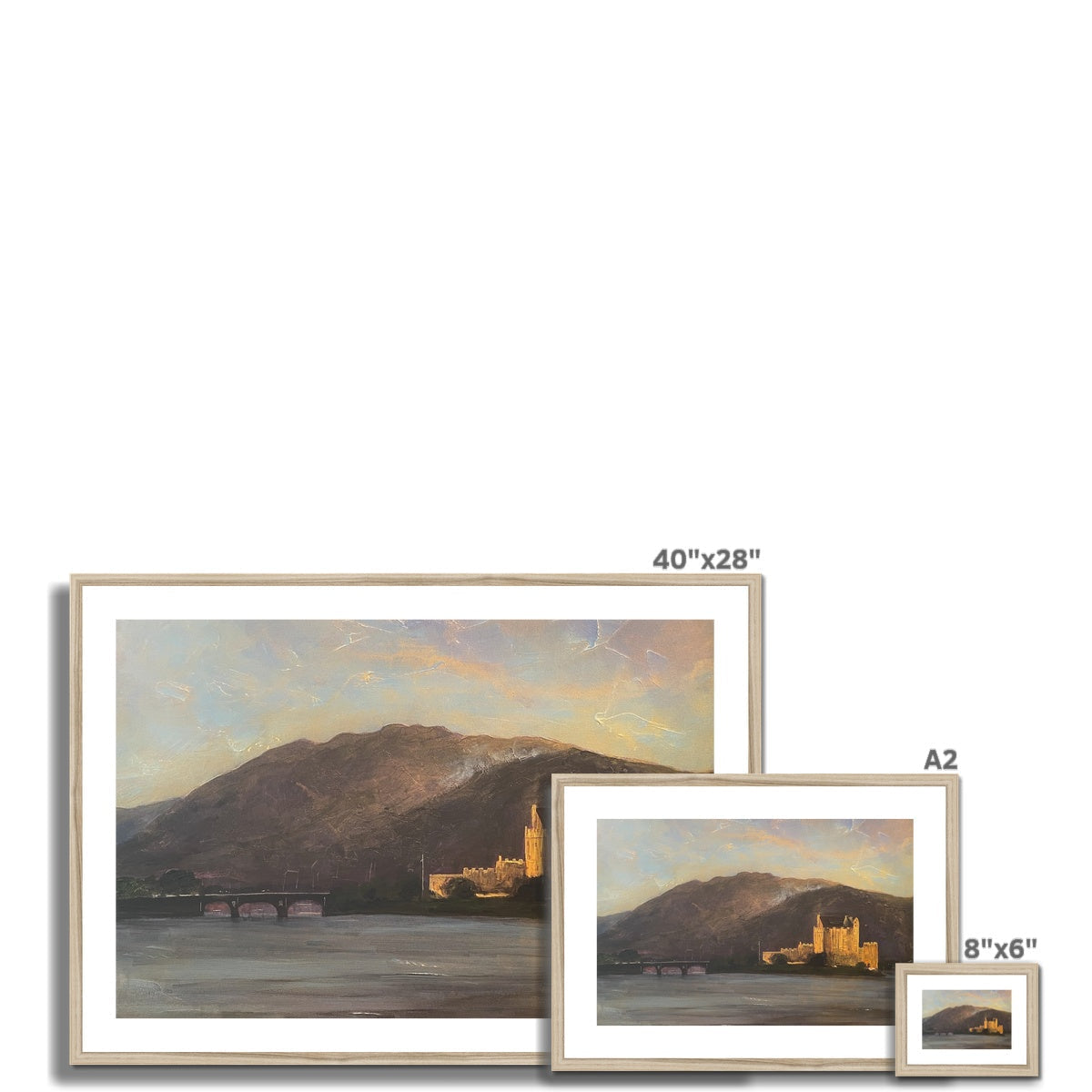 Framed landscape paintings of Eilean Donan Castle in various sizes displayed for sale