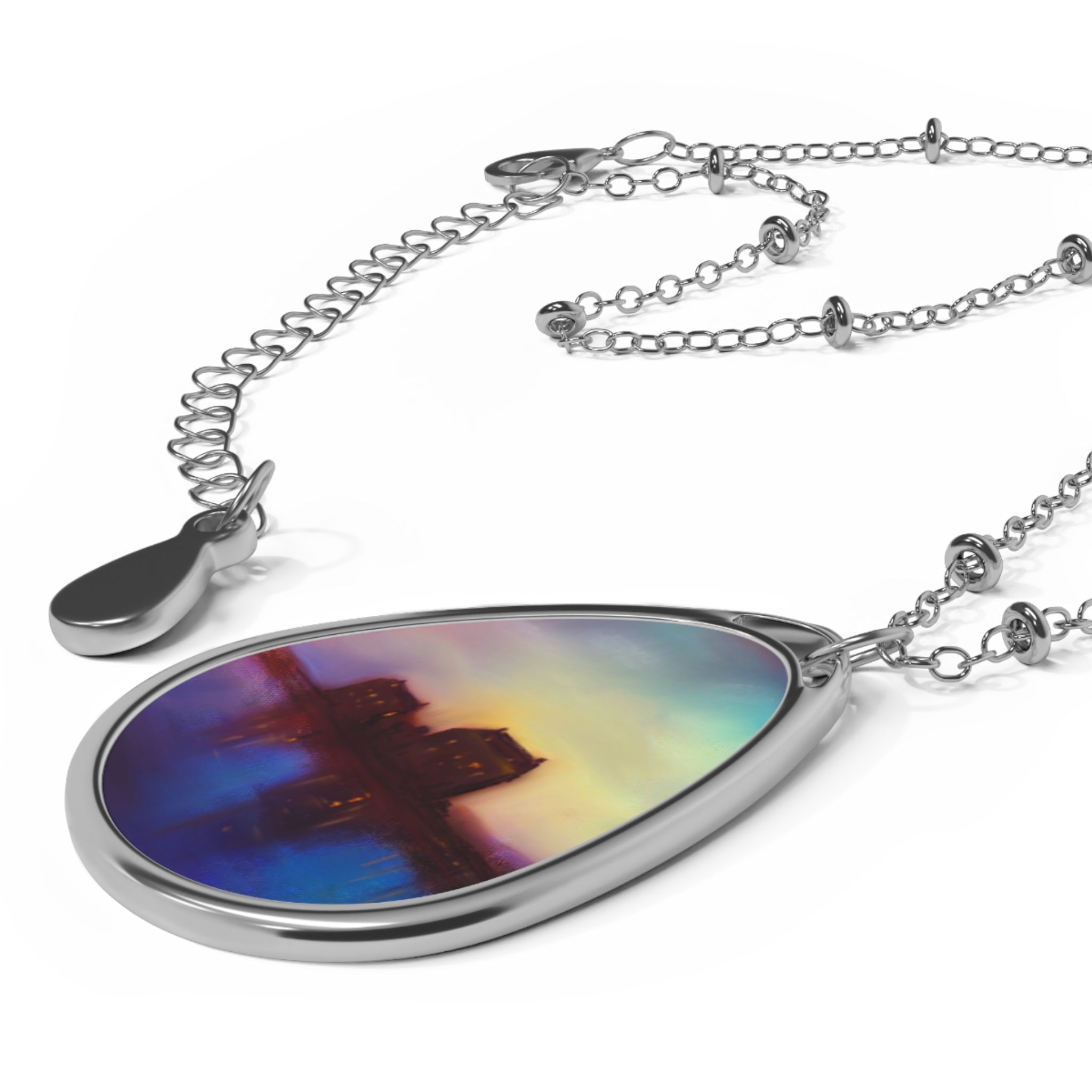 Silver-toned teardrop pendant necklace with colorful cross design from Eilean Donan Castle Sunset collection