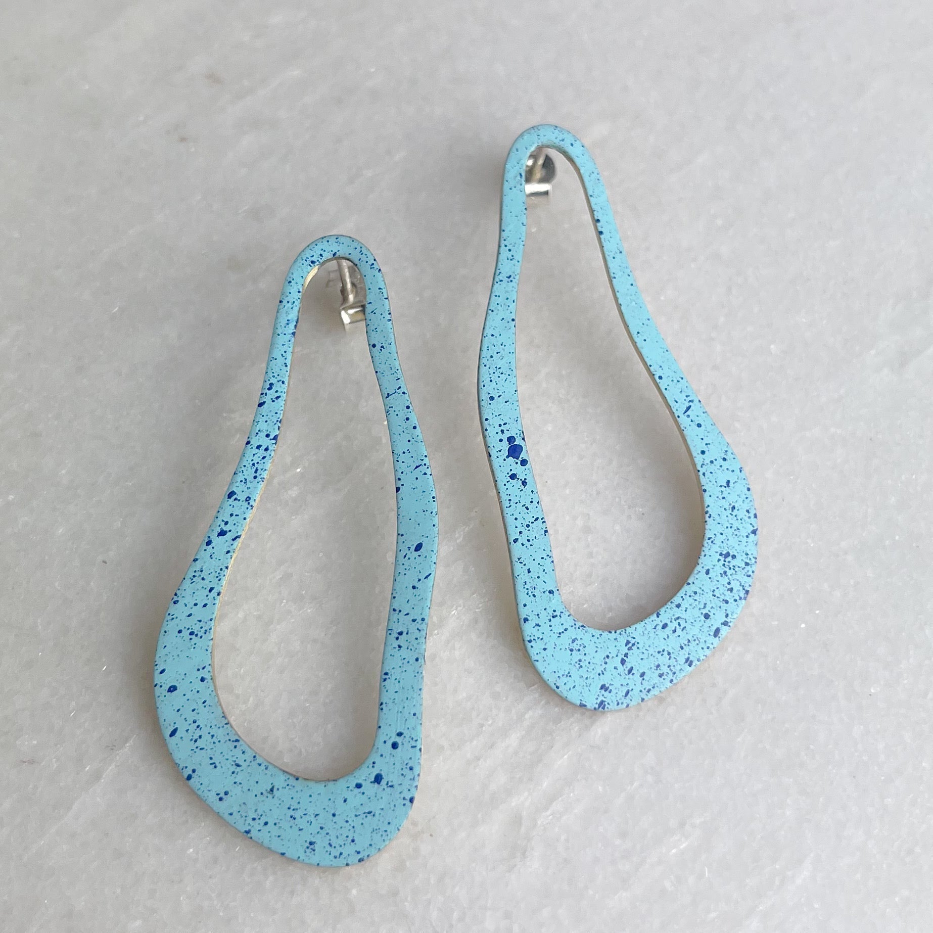 Light blue speckled pear-shaped El Medano Dali earrings with silver hooks by Lindsay Mcdowall Jewellery