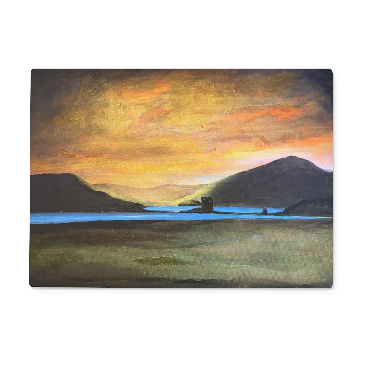Castle Stalker Glow sunset over water on glass chopping board