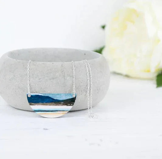 Winter Luskentyre half-moon pendant necklace with blue landscape design