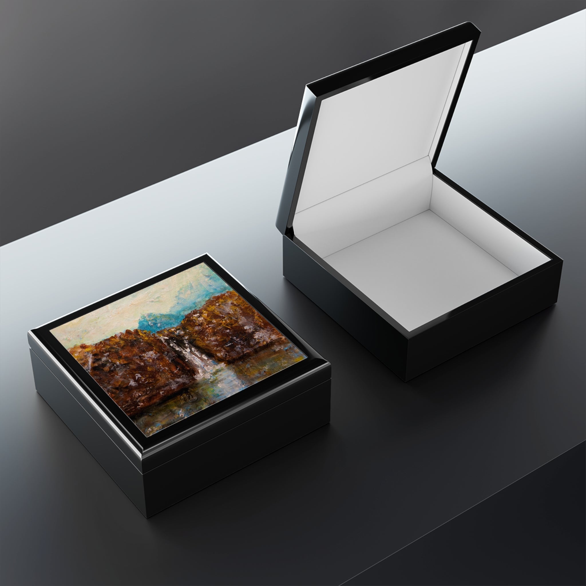 Black wooden keepsake and jewelry boxes with landscape art and white interior design