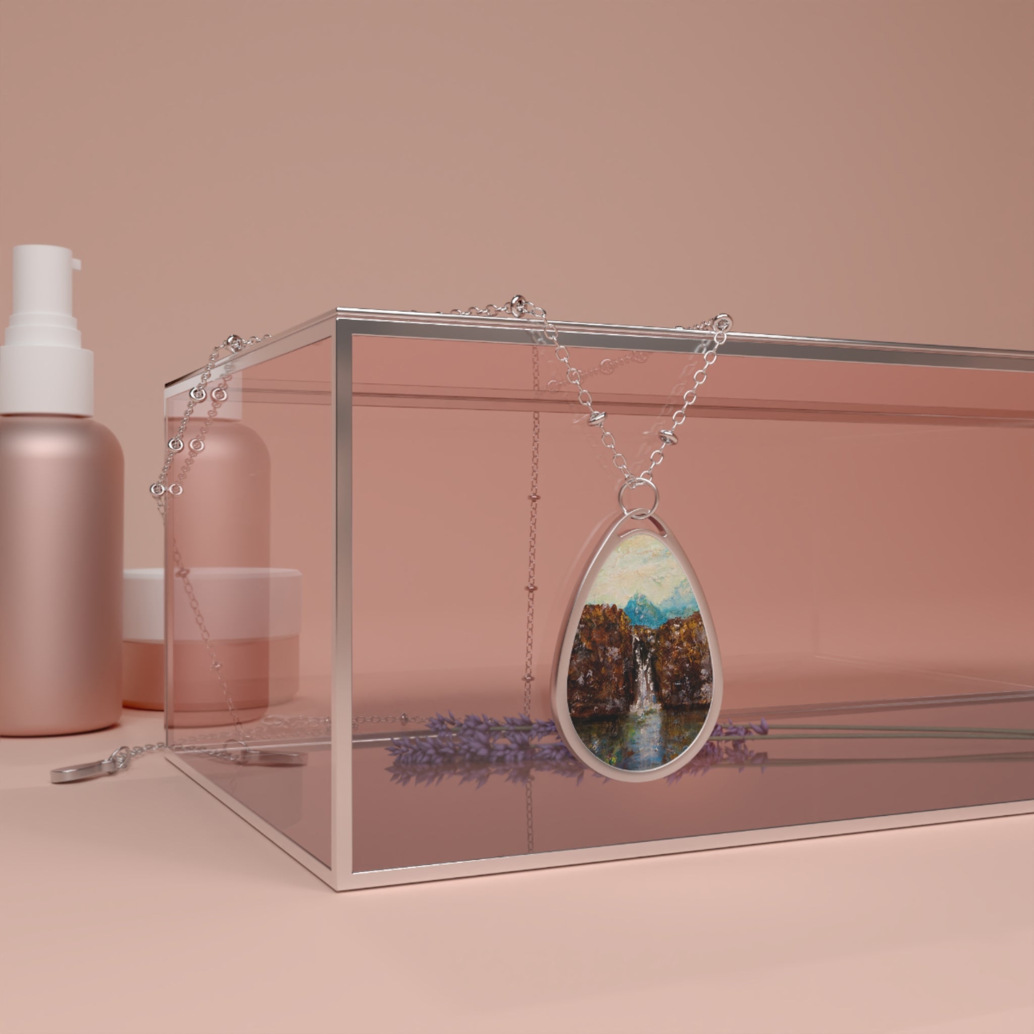 Silver teardrop pendant featuring a nature scene of a waterfall and mountains from The Fairy Pools Skye necklace