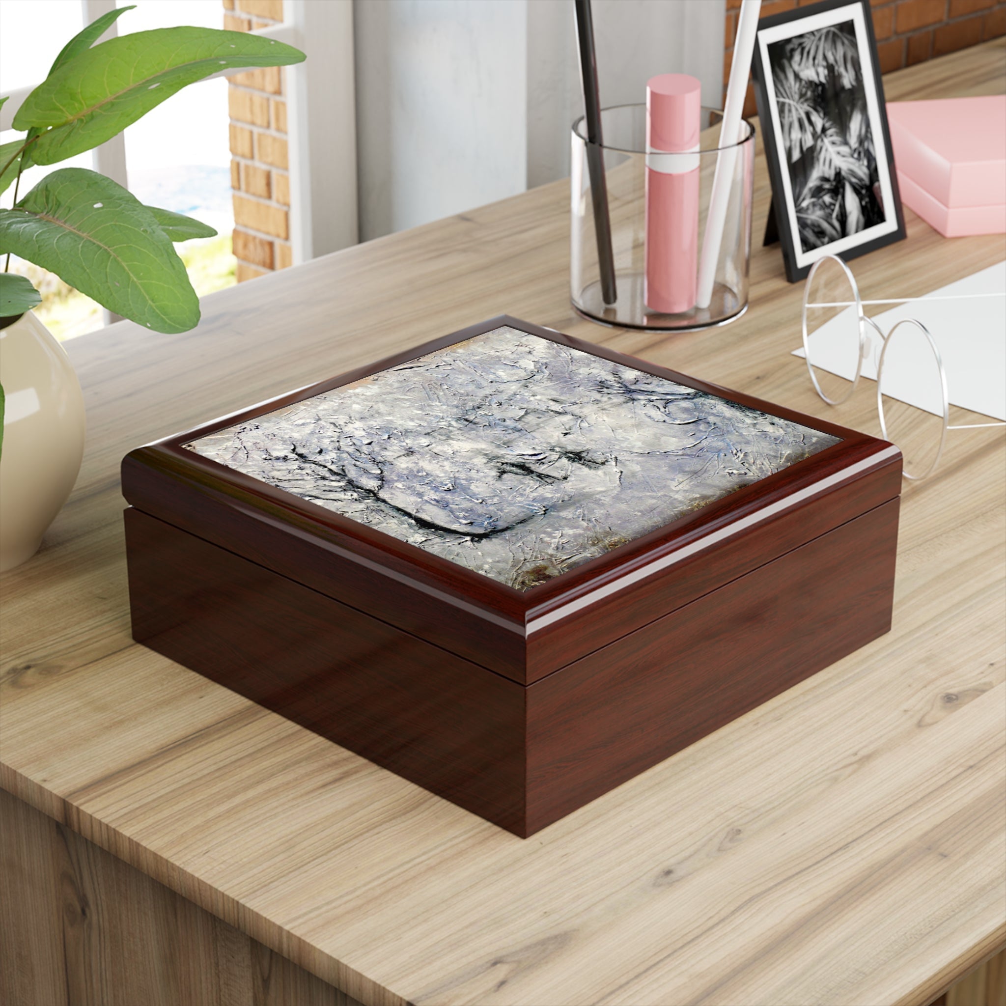 Mahogany-colored wooden keepsake box with marbled gray and white abstract lid design