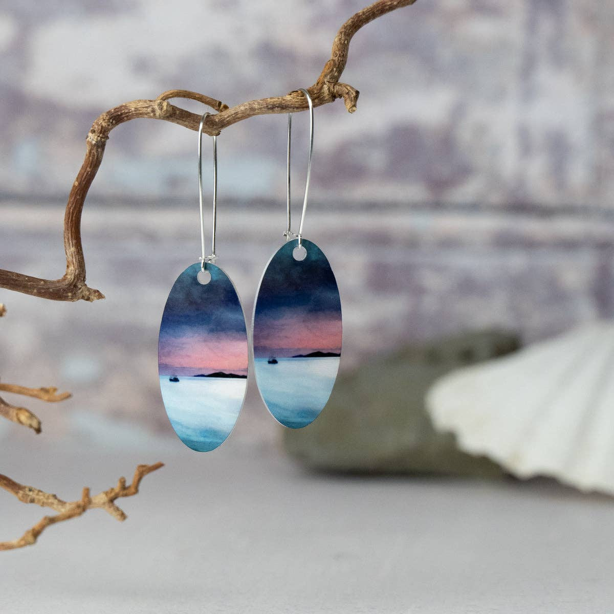 Elegant oval aluminum silver earrings with serene Little Minch sunset design by Cath Waters