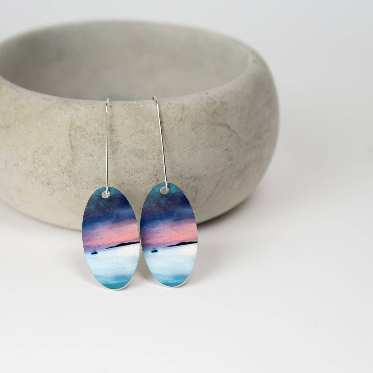 Elegant oval Fishing the Little Minch earrings with sunset over water design