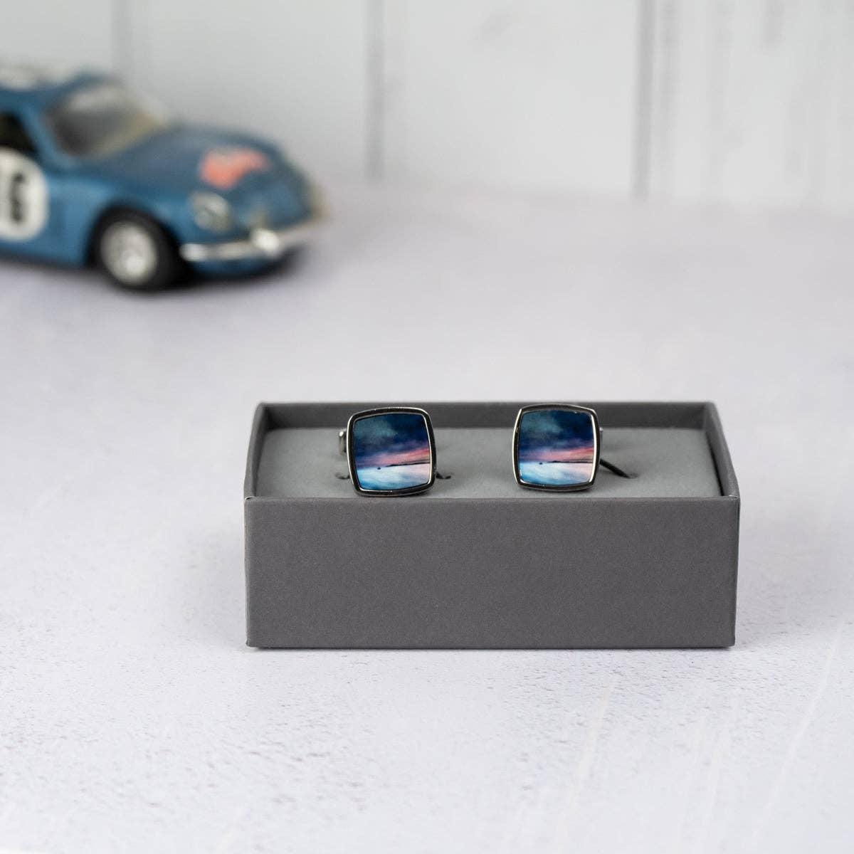 Square silver cufflinks with Fishing the Little Minch sunset over water