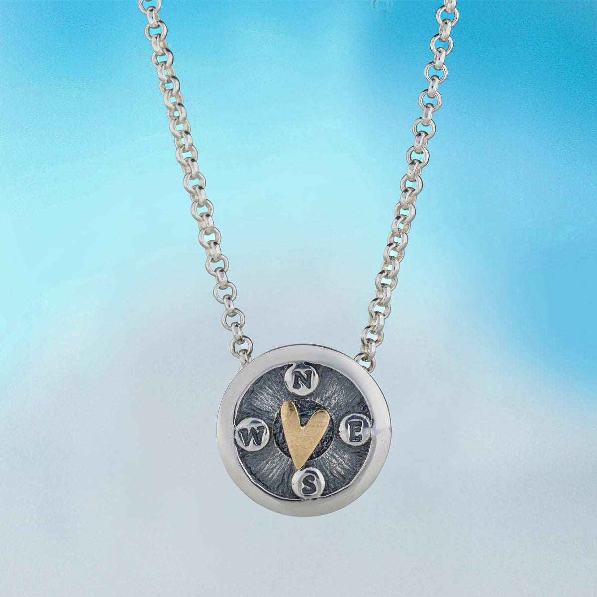 Silver and gold compass heart pendant necklace by Alan Ardiff Jewellery