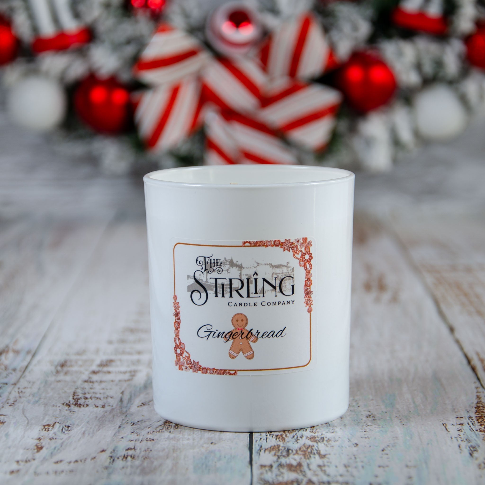 Gingerbread large candle in white ceramic jar with Stirling label and gingerbread man illustration