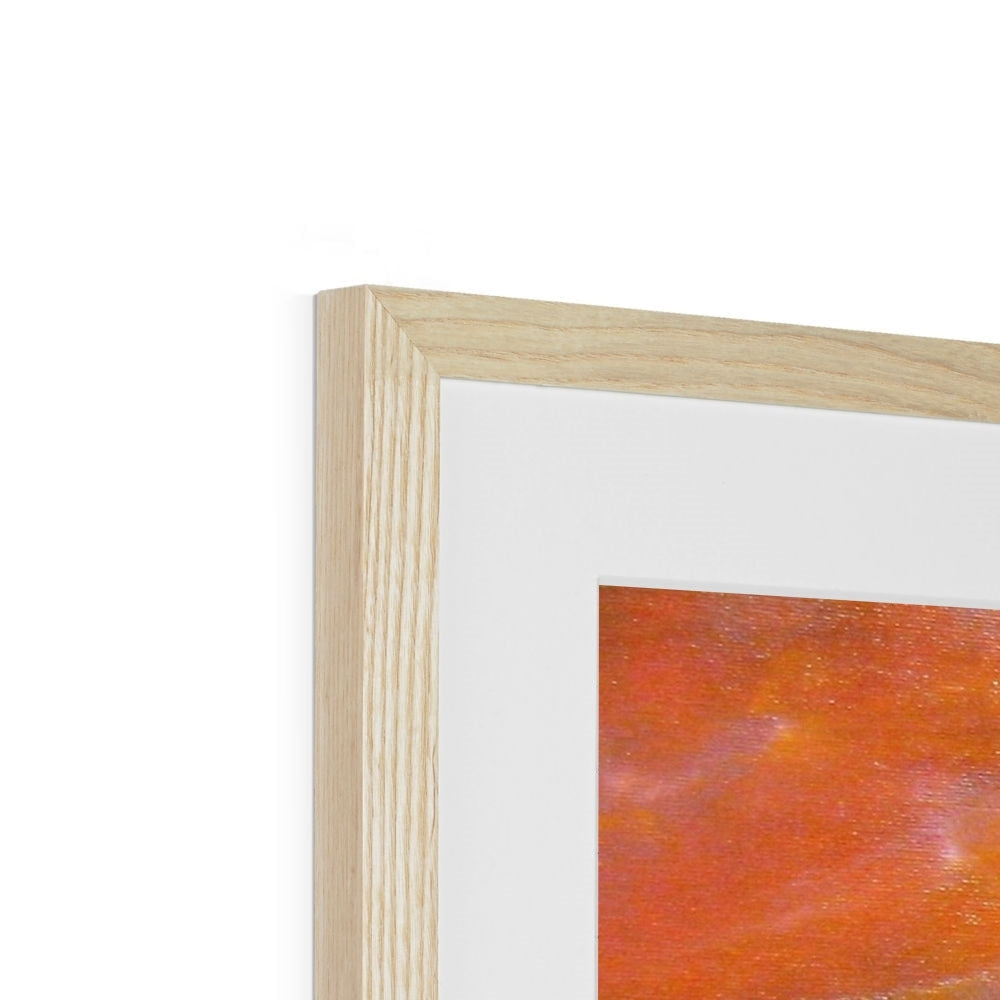 Light wood picture frame with white mat displaying abstract art in warm orange and red tones