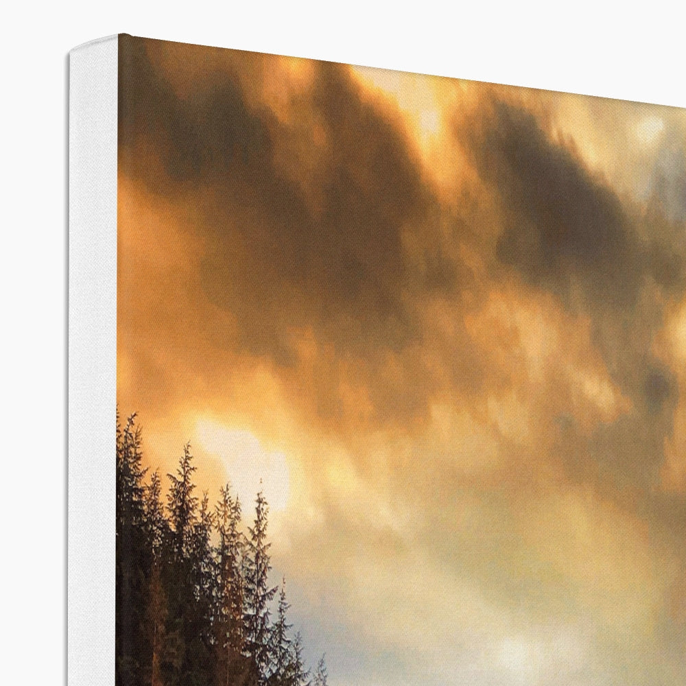 Golden sunset clouds over evergreens in Glencoe Lochan Dusk canvas print