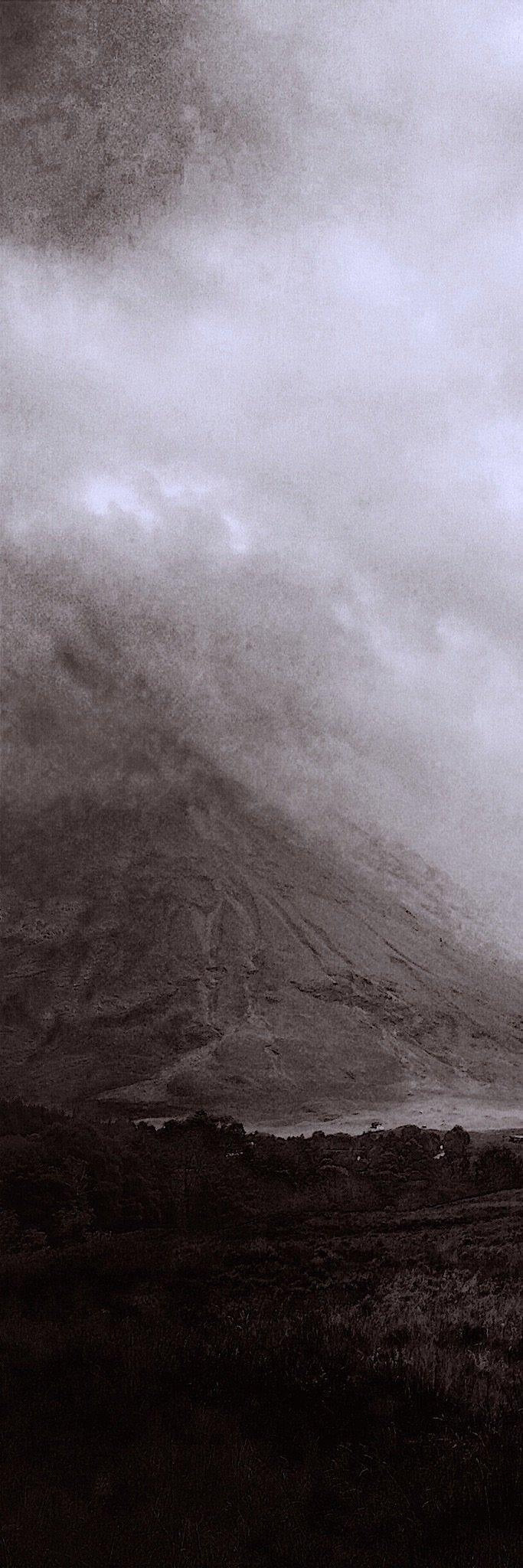 Scenic Scottish landscape with dark mountains, water, and overcast sky for Glencoe Mist Triptych