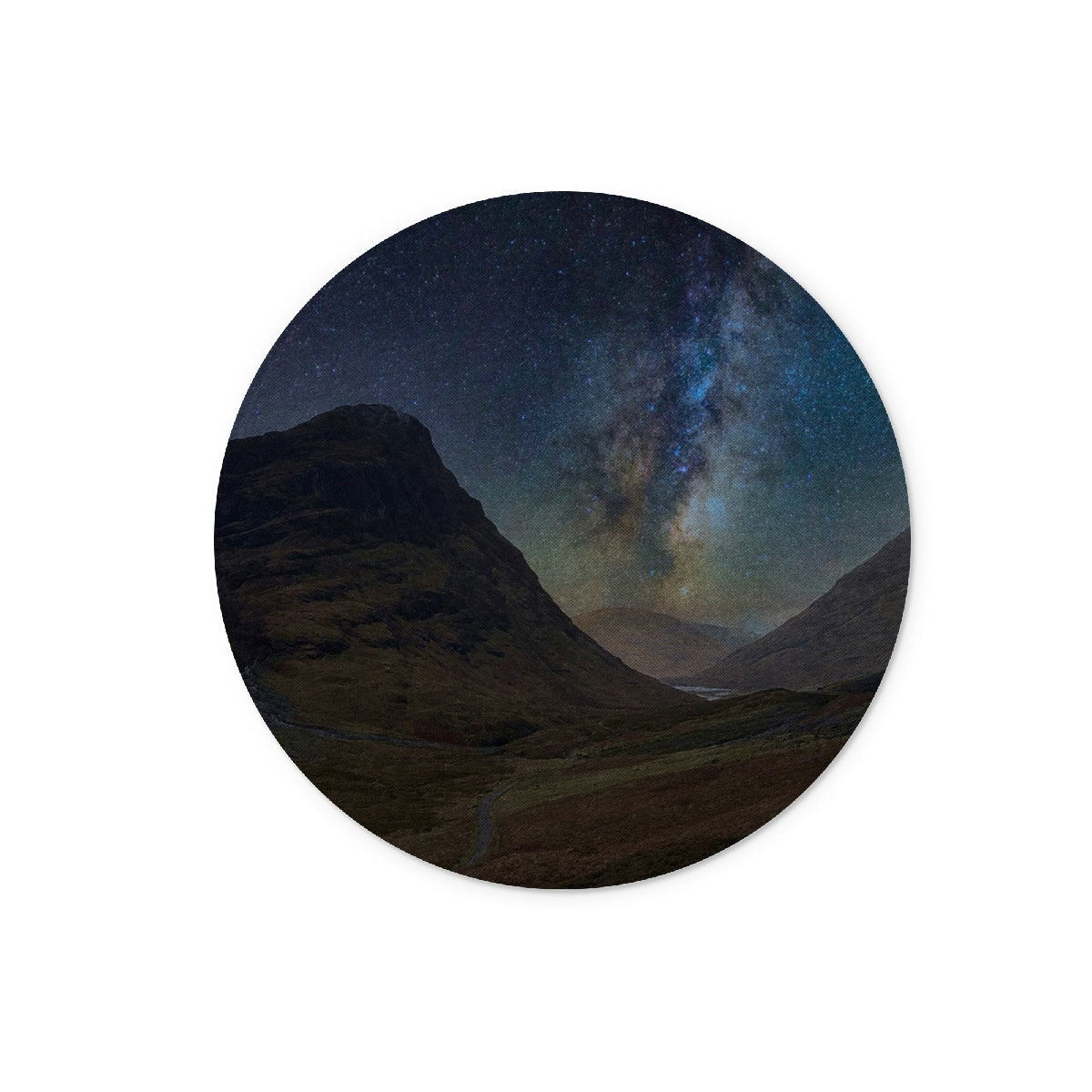 Circular wooden coaster with vivid Milky Way over Glencoe mountains