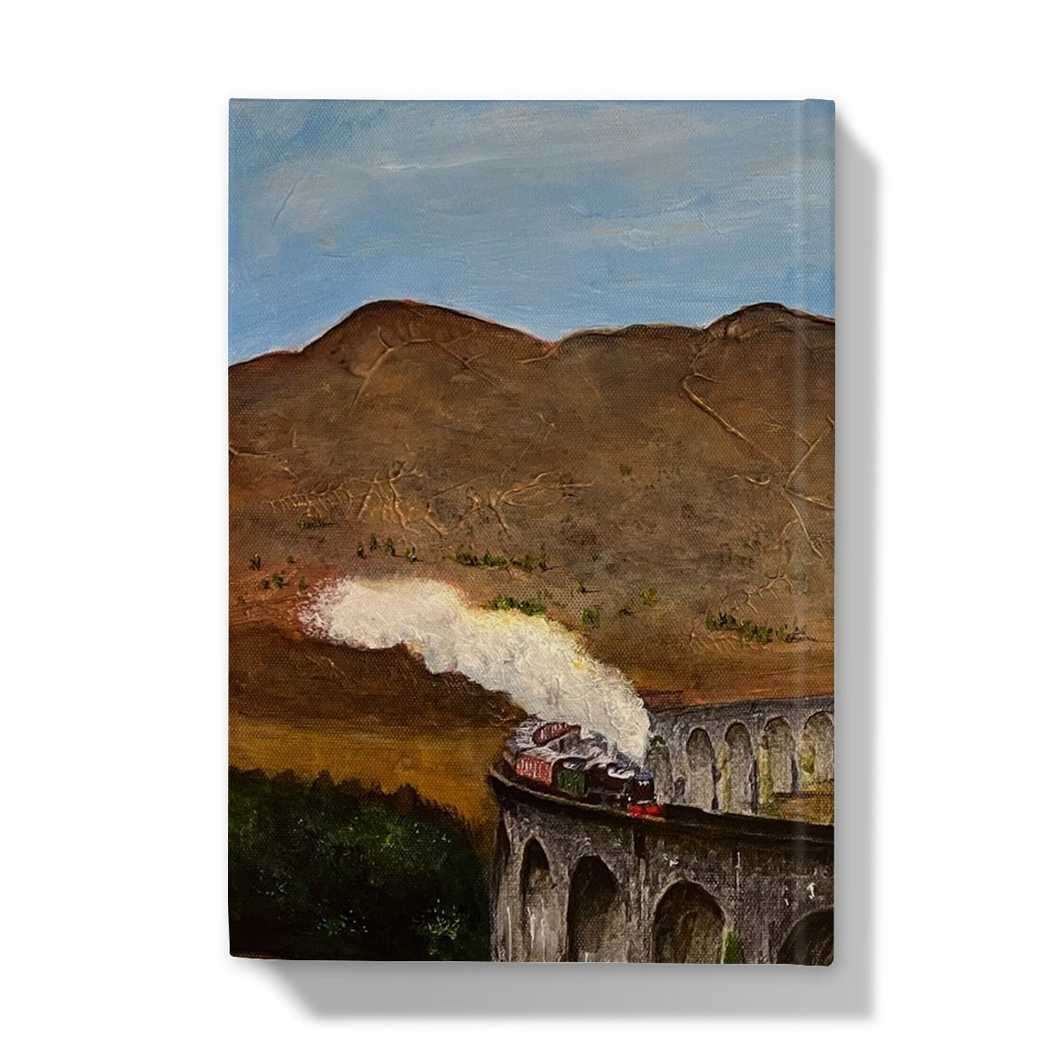 Steam locomotive model train on bridge with smoke, Glenfinnan Viaduct Journal