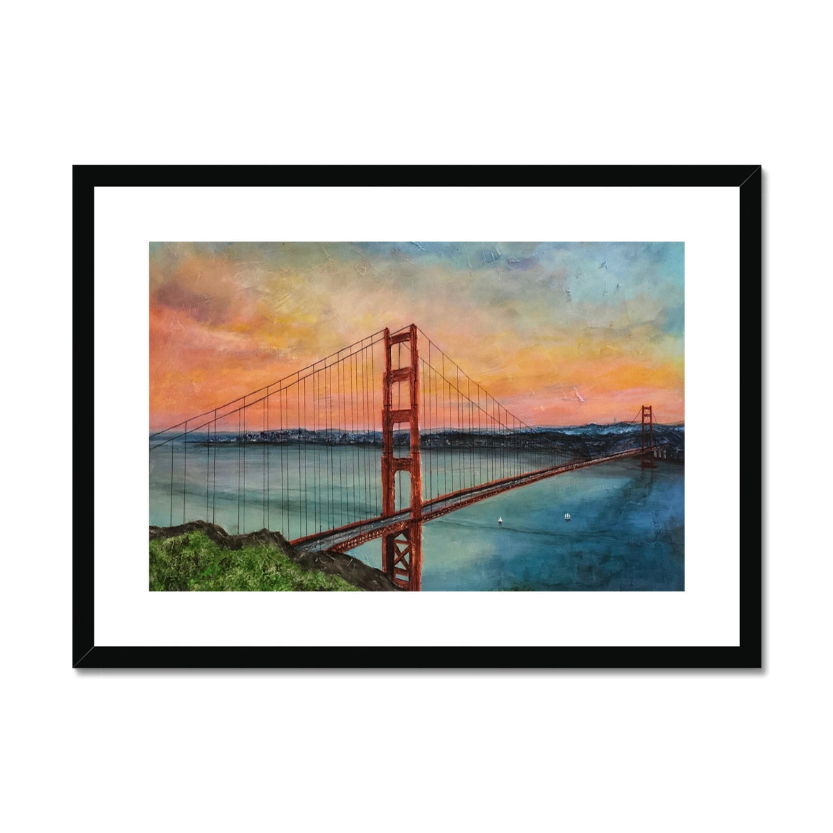 Framed Golden Gate Bridge print mounted on wall