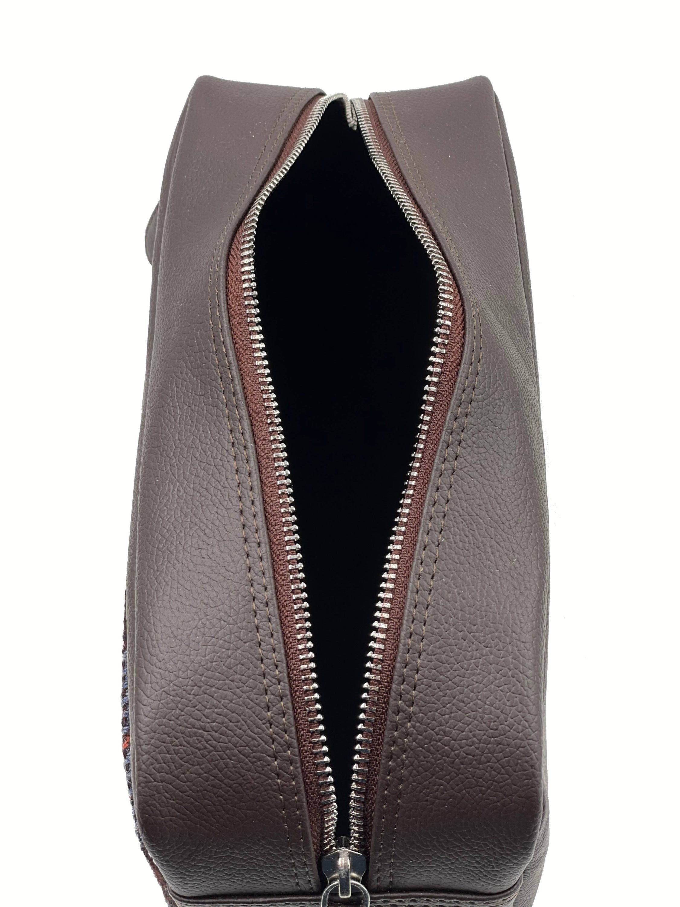 Brown leather toiletry bag with silver zipper and check pattern