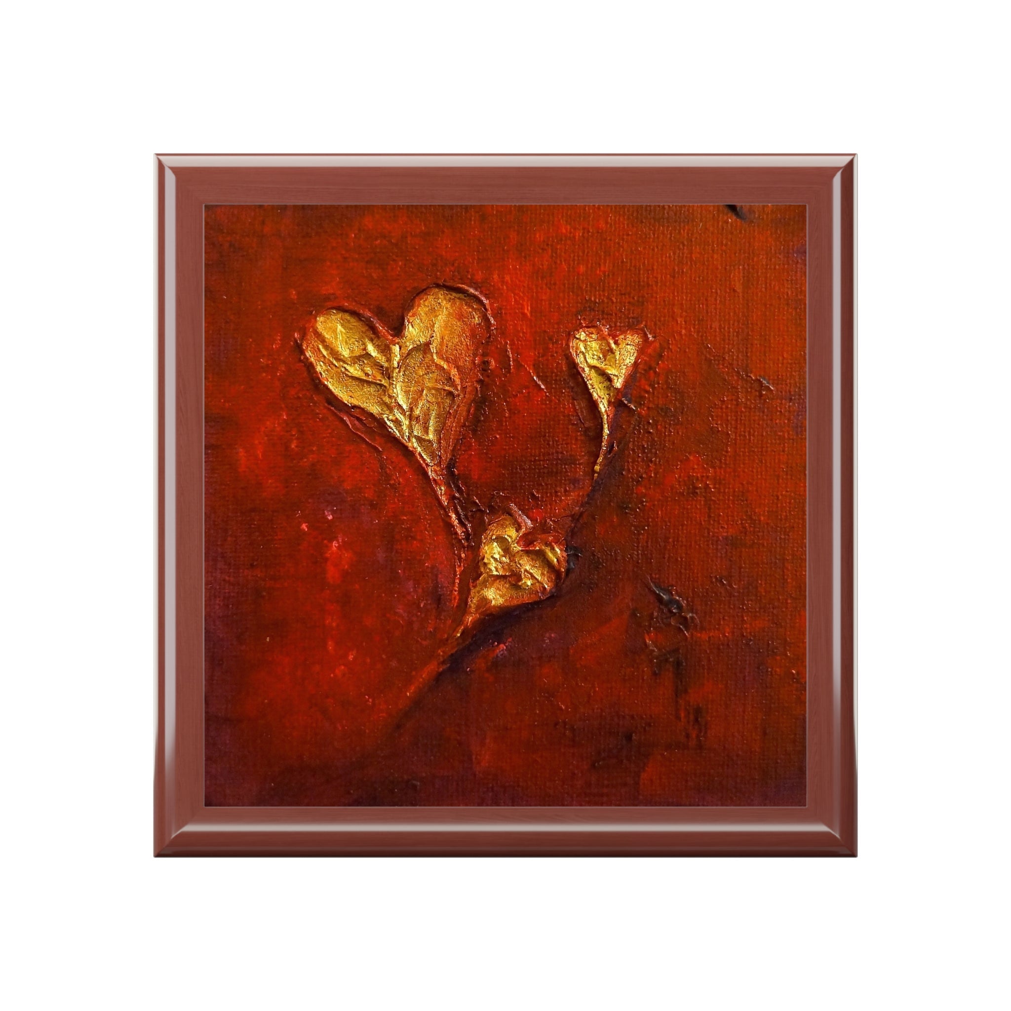 Framed abstract painting with golden heart shapes on textured red and orange background in Scotland