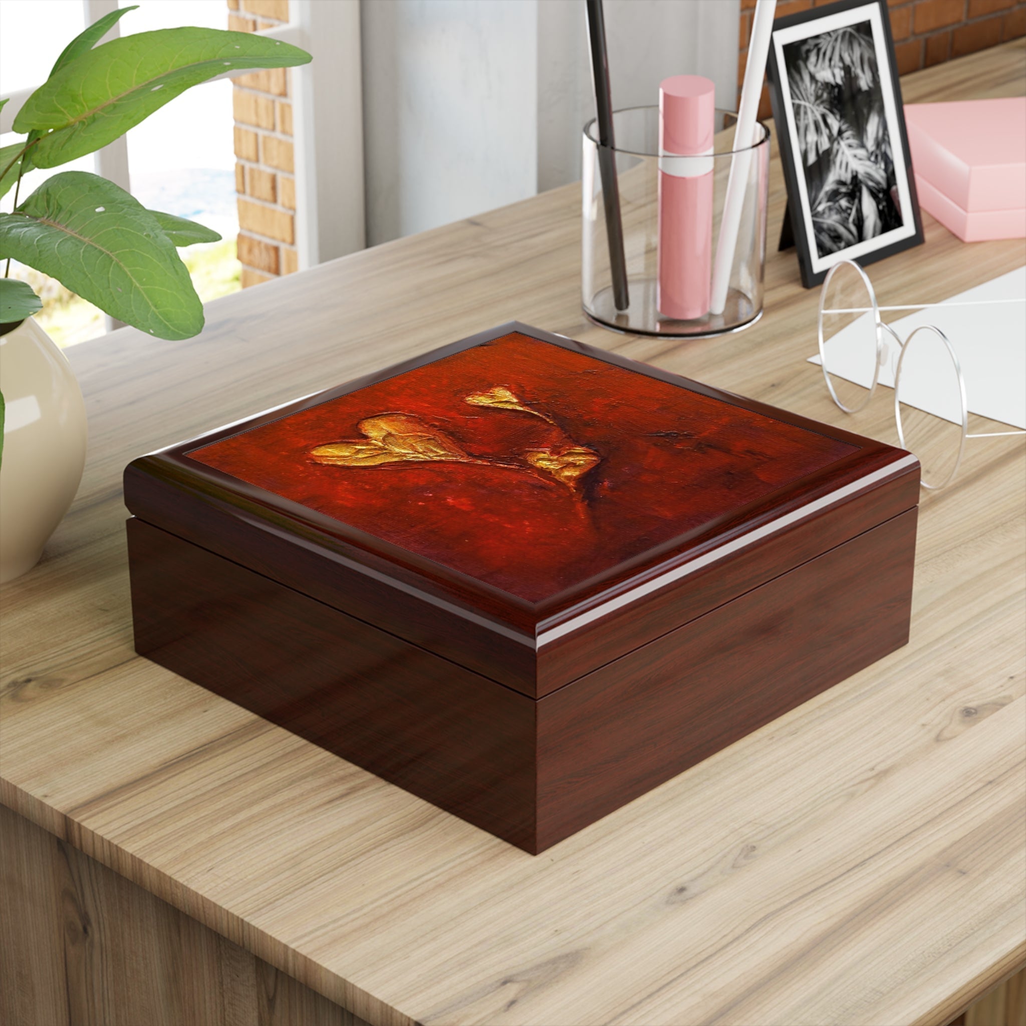 Dark wooden jewelry box with glossy red lid and golden leaf designs from Hearts Art Jewellery Box Scotland