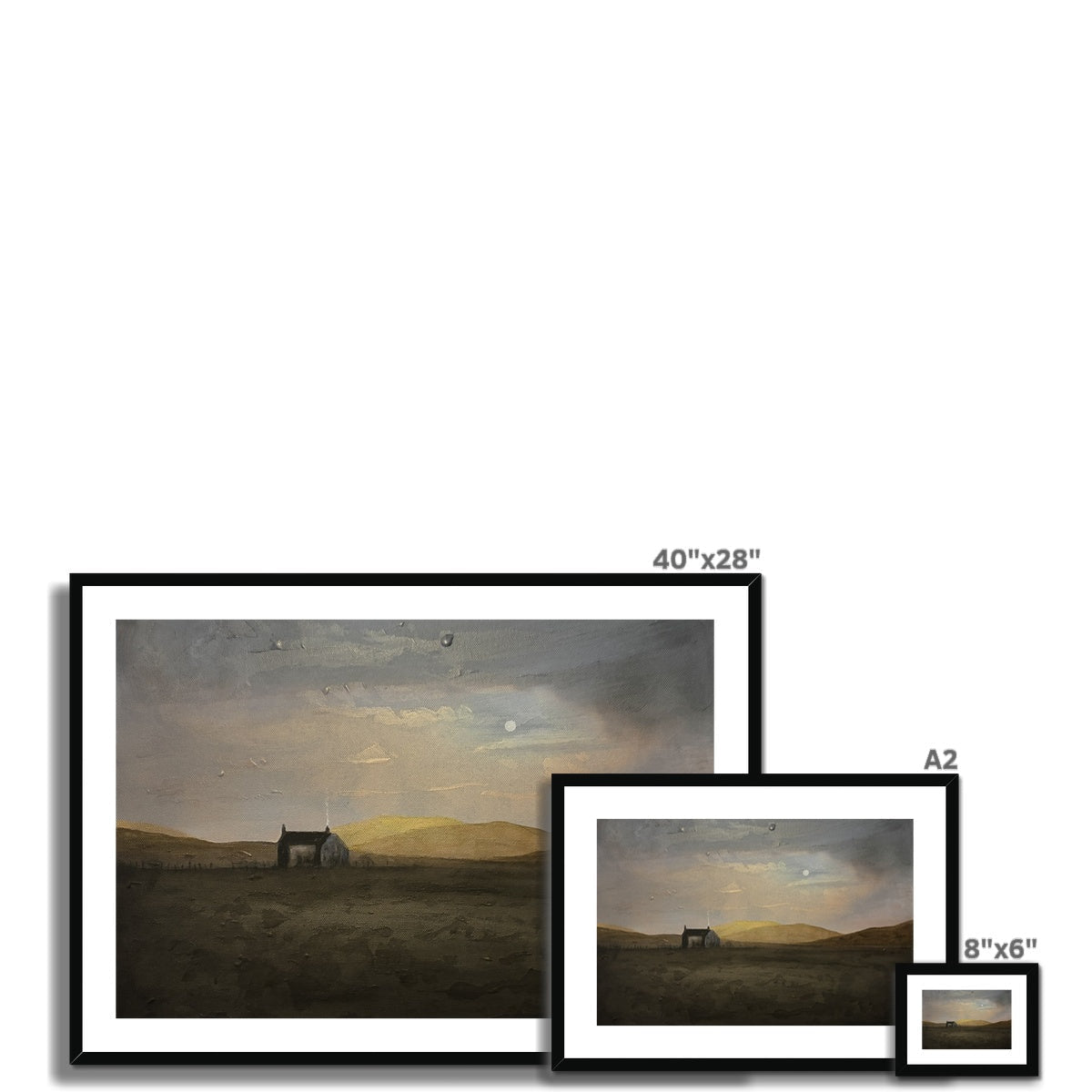 Black-framed Hebridean Croft House print with moody sky and golden light