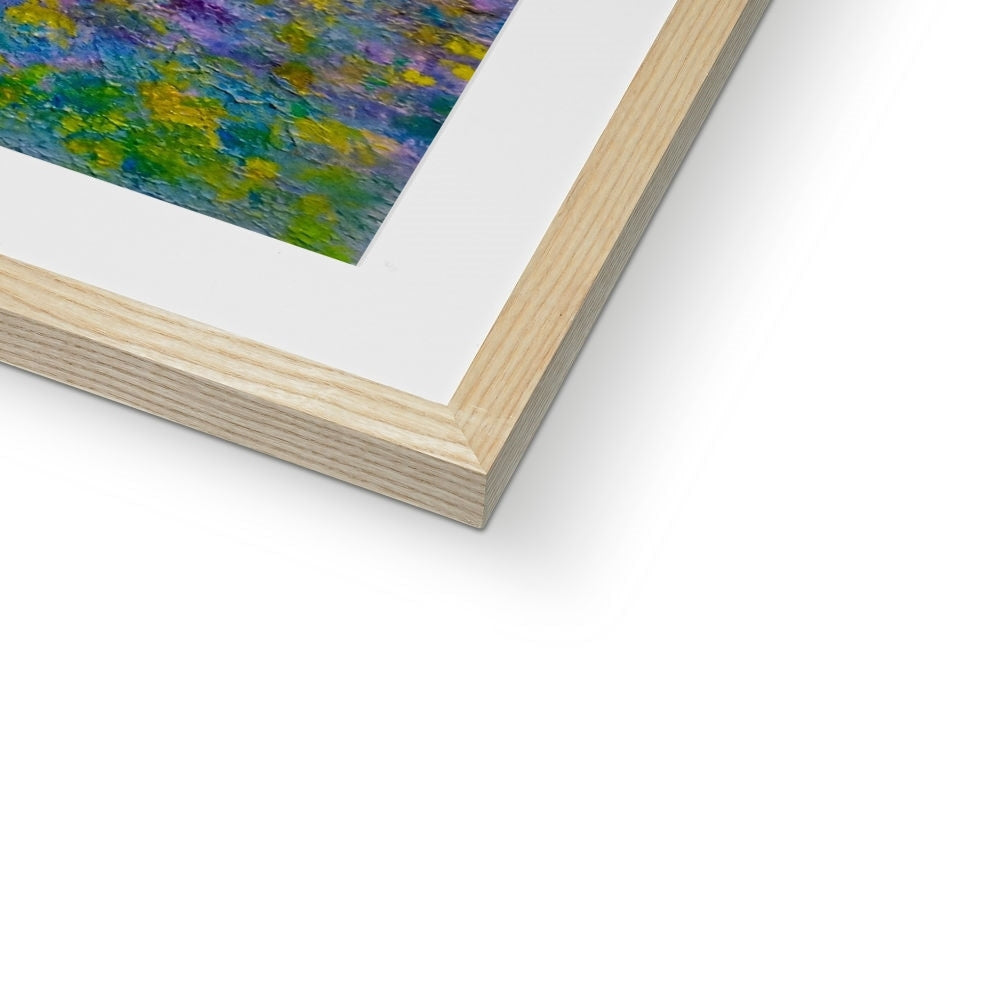 Light-colored wooden picture frame with white mat holding a vibrant Highland Bluebells print