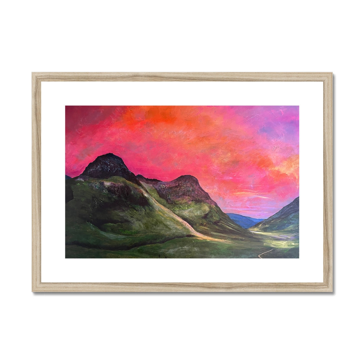 Into The Glencoe Dusk: wooden-framed print of pink-orange sunset over green hills and road
