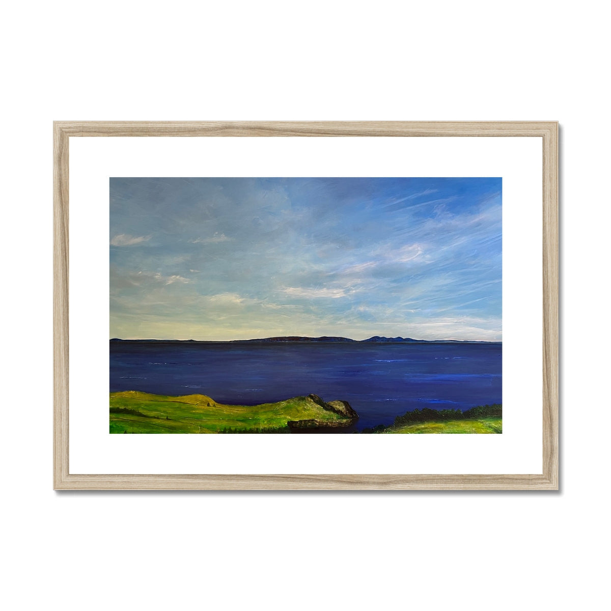 Wooden framed landscape print of green grass and blue sky from Ireland to Scotland