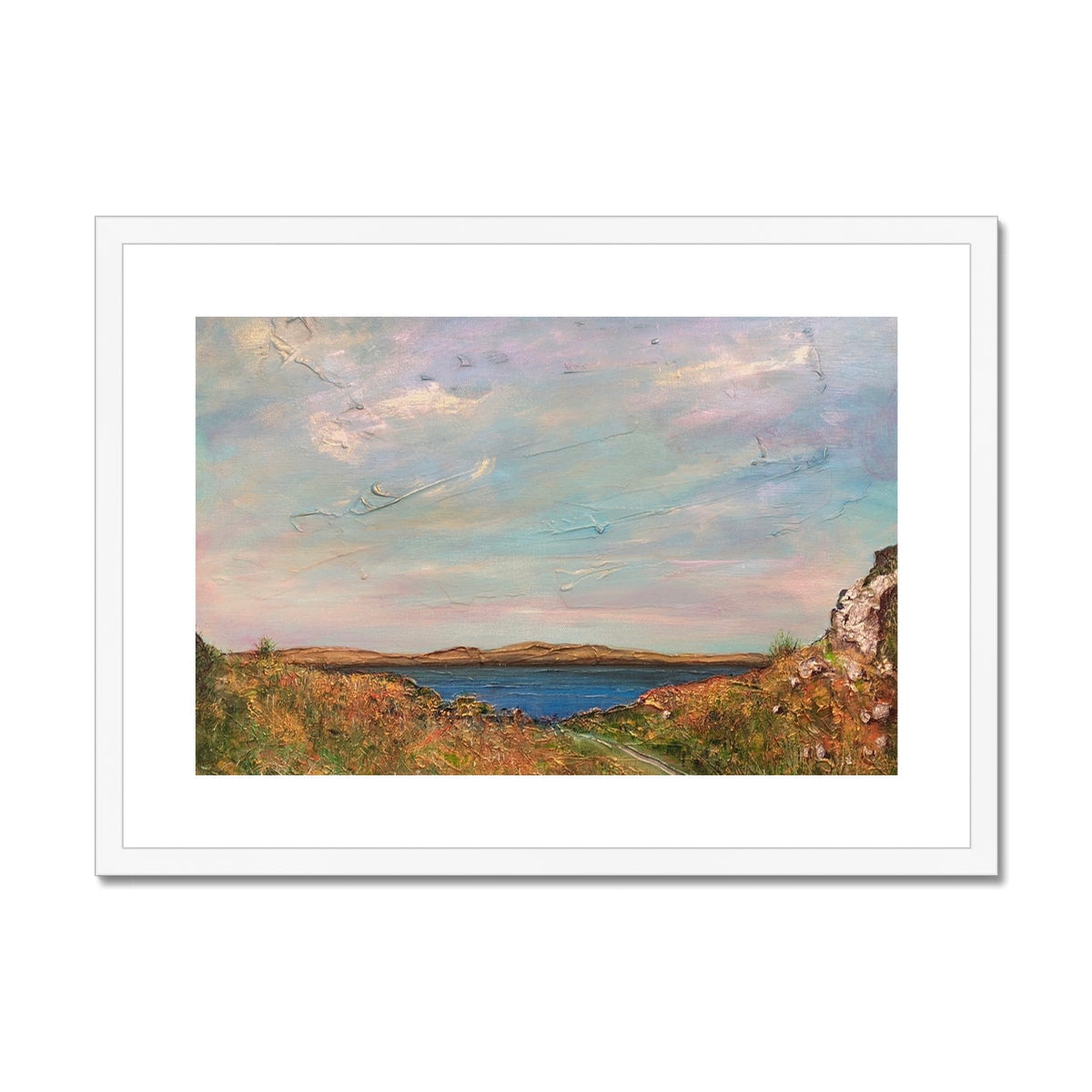 Jura from Crinan framed print of blue sky and green grass landscape