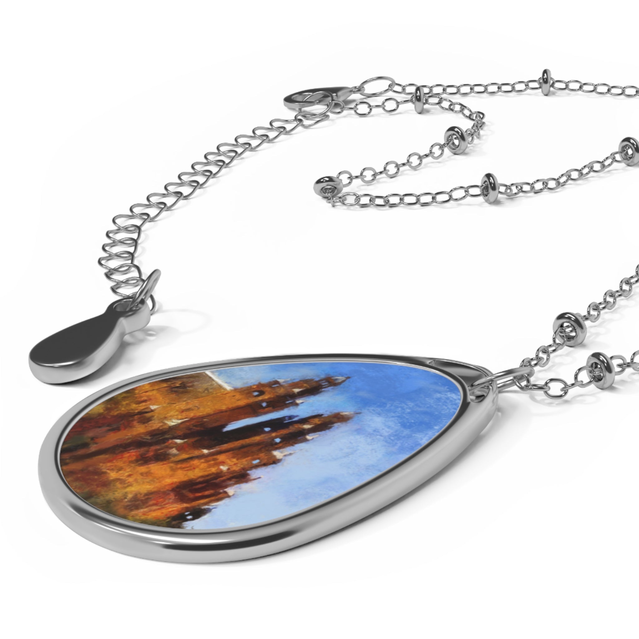 Silver teardrop pendant necklace with Kelvingrove castle art on blue sky