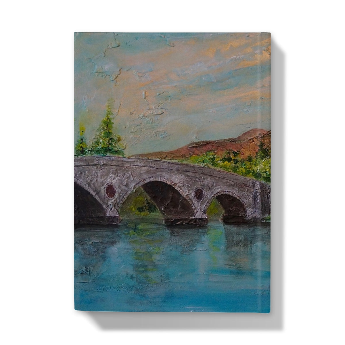Stone bridge puzzle piece with arches and greenery on Kenmore Bridge II journal