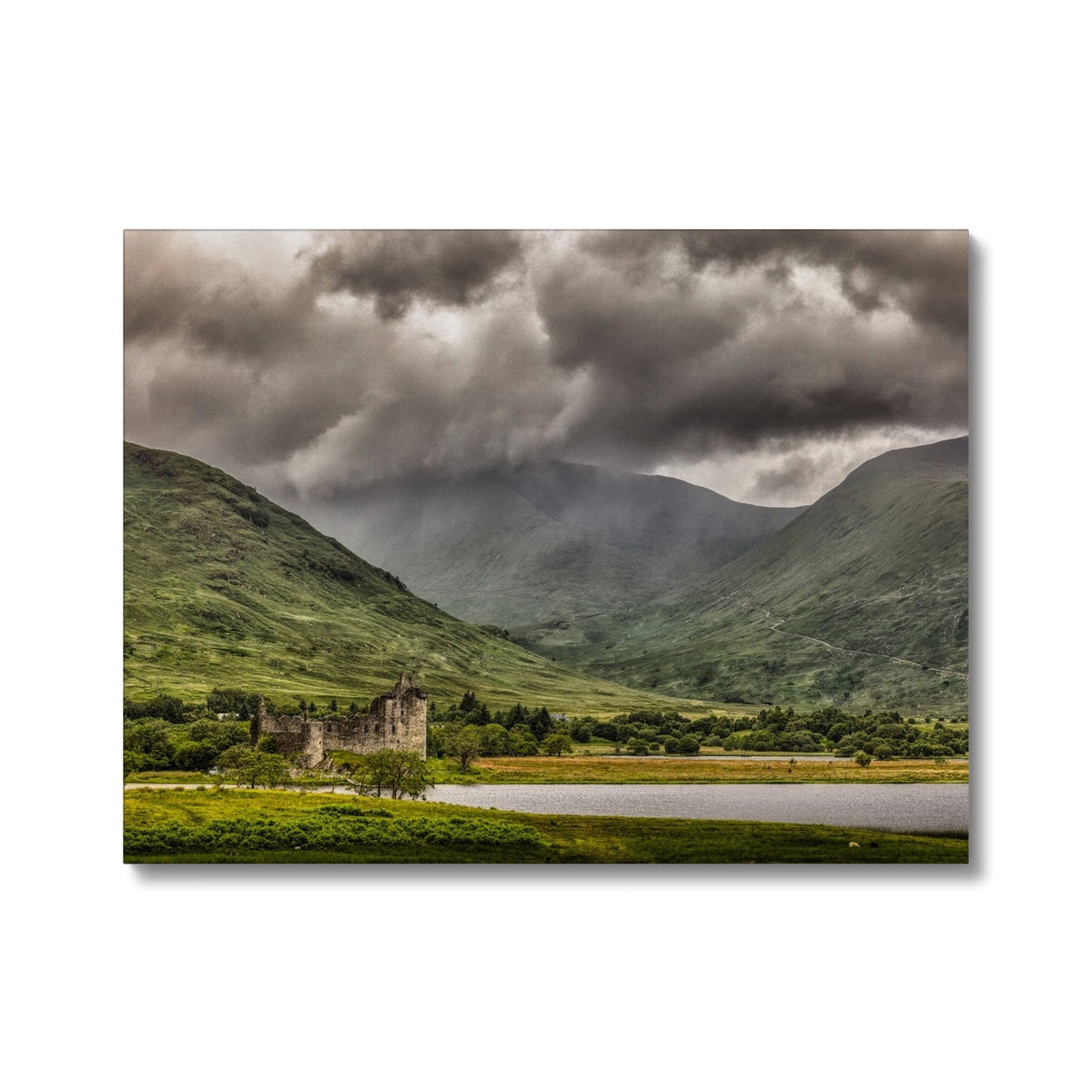 Kilchurn Castle ruins in green grassy field with mountains, canvas print