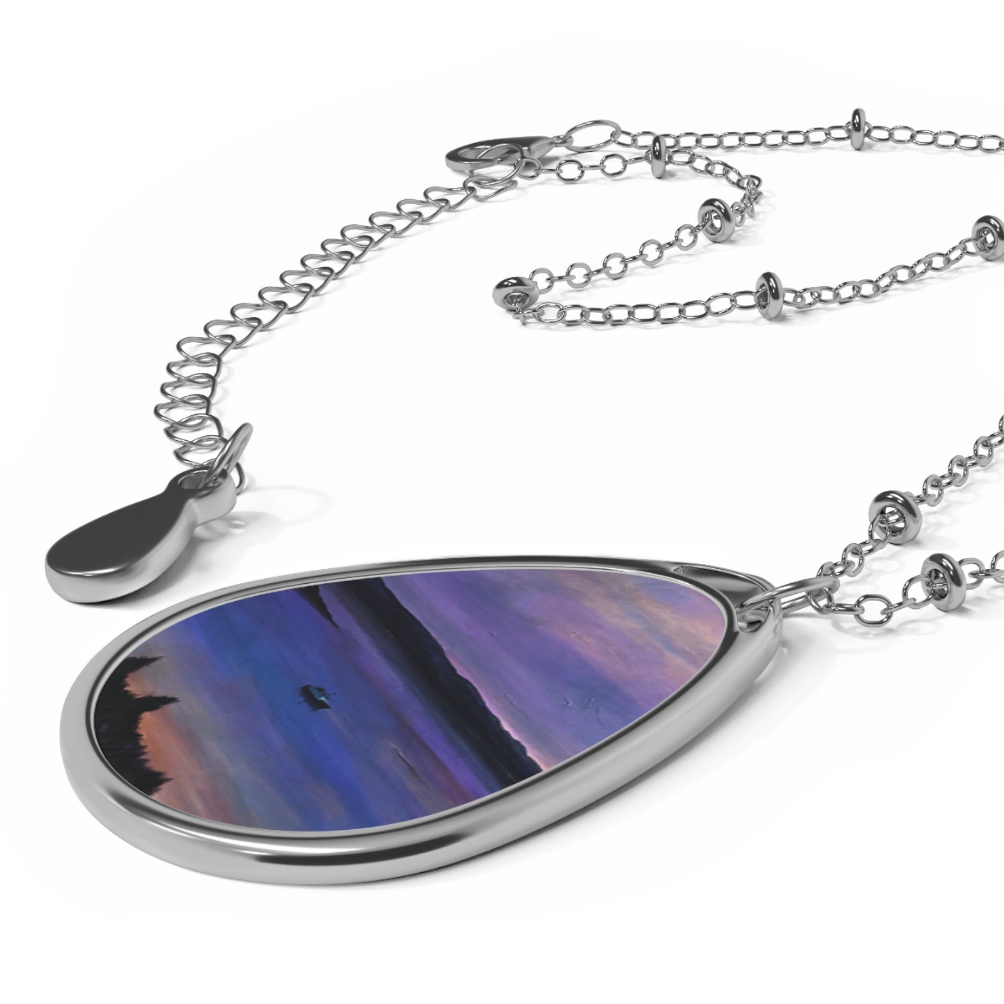 Lamlash Dusk silver teardrop pendant with purple-blue gradient art