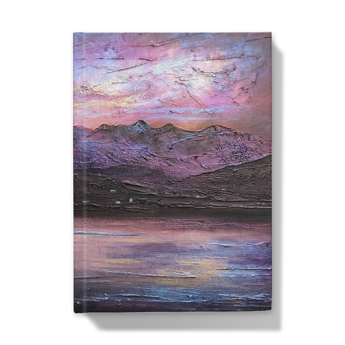 Textured painting of a mountainous landscape at sunset with lake reflection on the Last Skye Light Hardback Journal