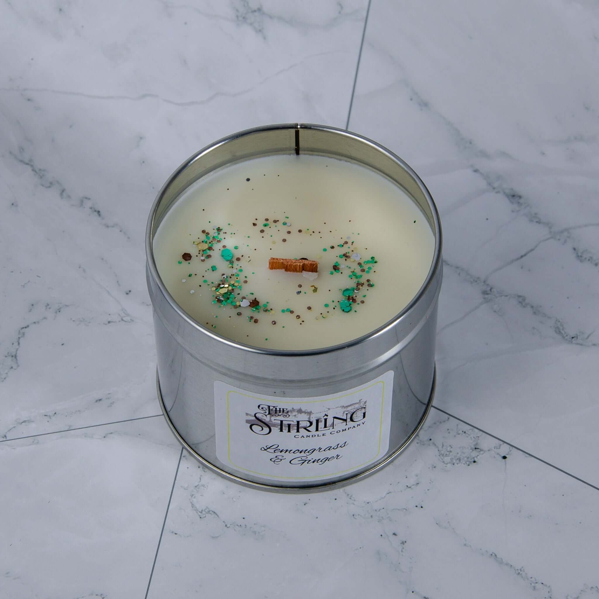 Lemongrass & Ginger travel tin candle with wooden wick, glitter & cinnamon stick