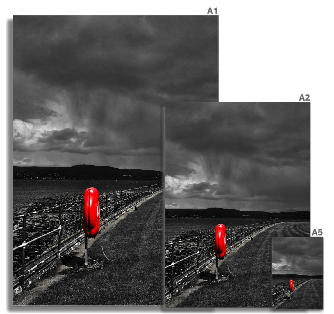 Vibrant red lifebuoy in monochrome coastal scene, red fine art print