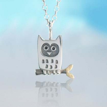 Silver little owl pendant necklace with black enamel eyes gold-tipped tail and textured body design