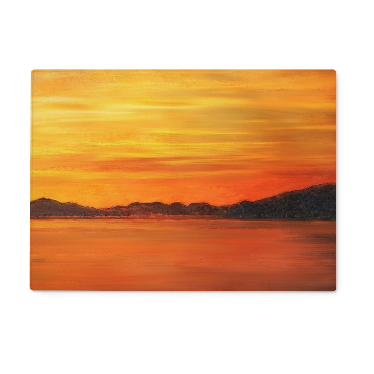 Orange sunset placemat with mountain silhouette design on Loch Fyne Sunset Glass Chopping Board