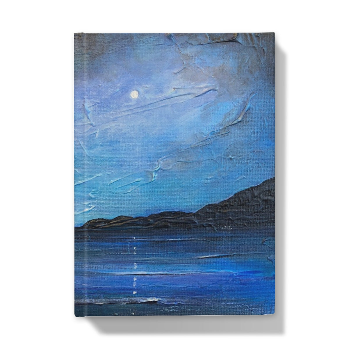 Blue textured Loch Ness Moonlight journal with moonlit coastal scene