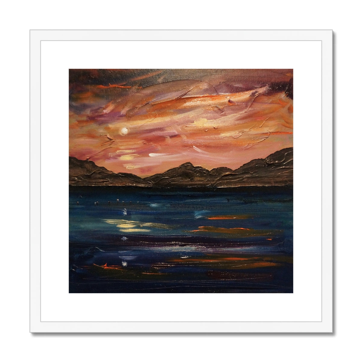 White framed Loch Ness Moonset abstract landscape print with orange-pink mountains and sky