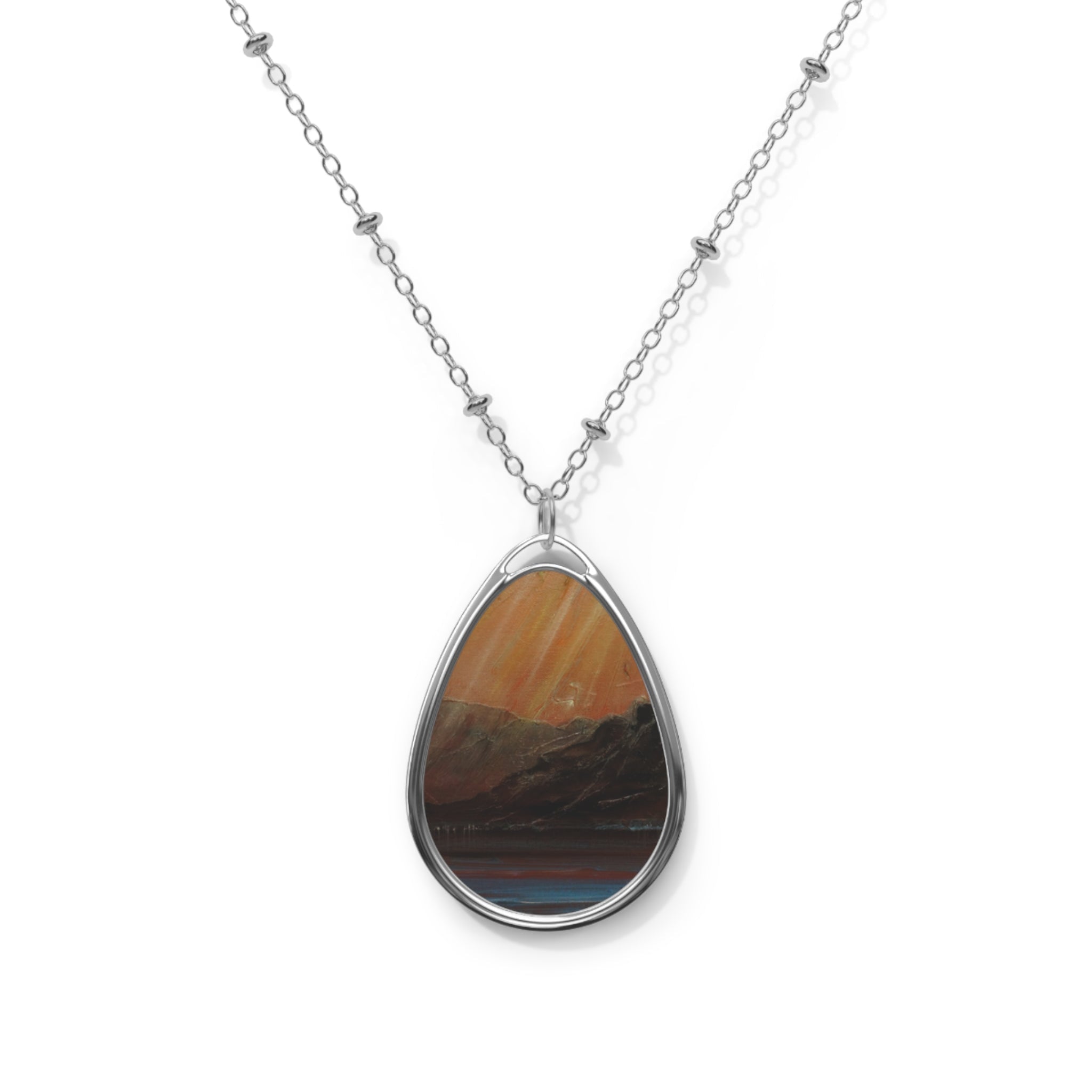 Silver chain necklace with teardrop pendant featuring a painted landscape scene from Loch Torridon Scottish Art Jewellery