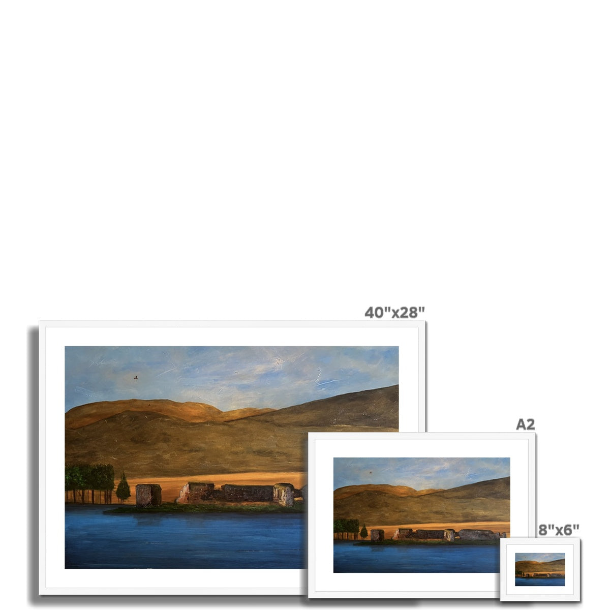 Set of three framed landscape prints of varying sizes featuring Lochindorb Castle
