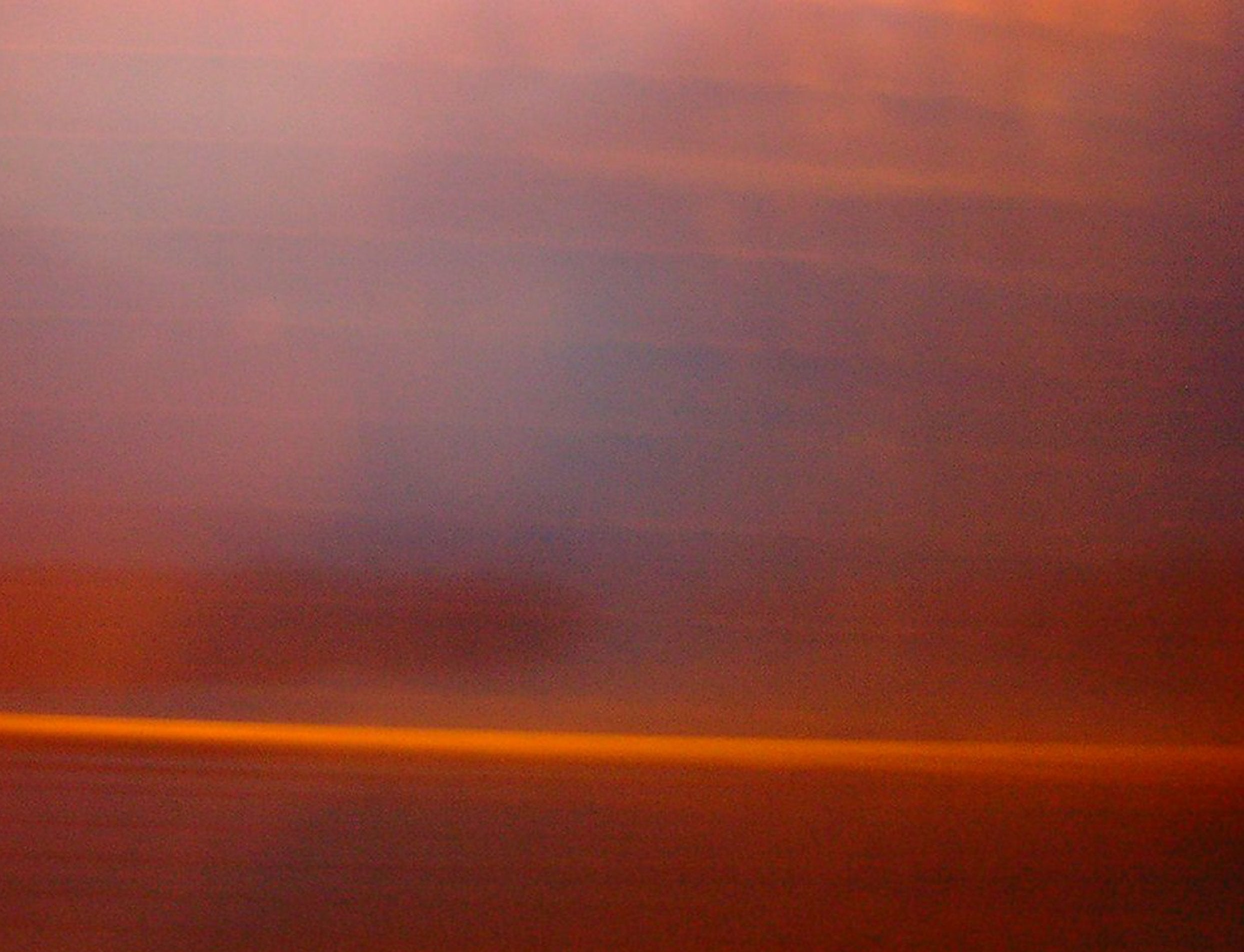 Blurry abstract orange-red streaks in The Longest Night painting