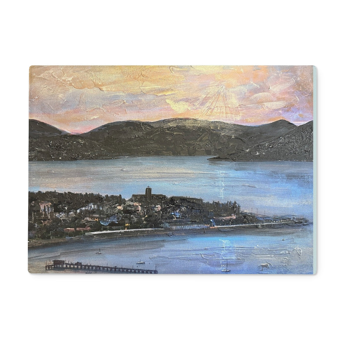 Textured painting of a coastal town with mountains and water on From Lyle Hill Glass Chopping Board