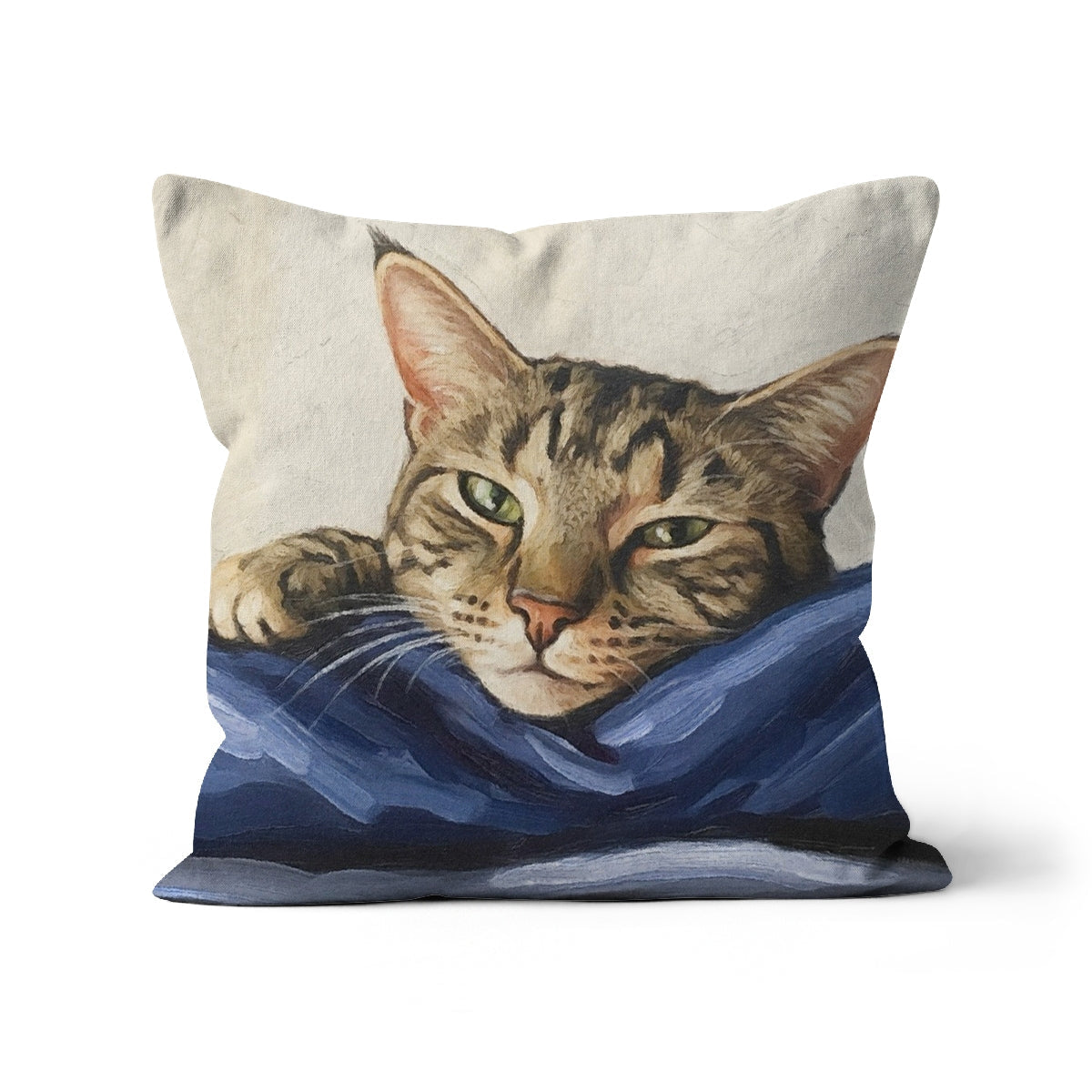 Mitzi tabby cat portrait square throw pillow with green eyes on blue fabric