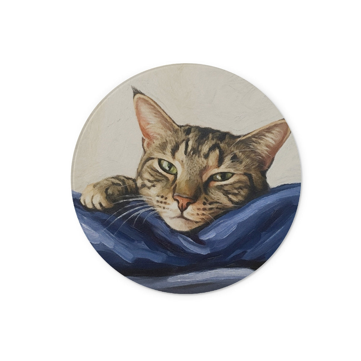 Mitzi tabby cat portrait circular coaster on blue fabric
