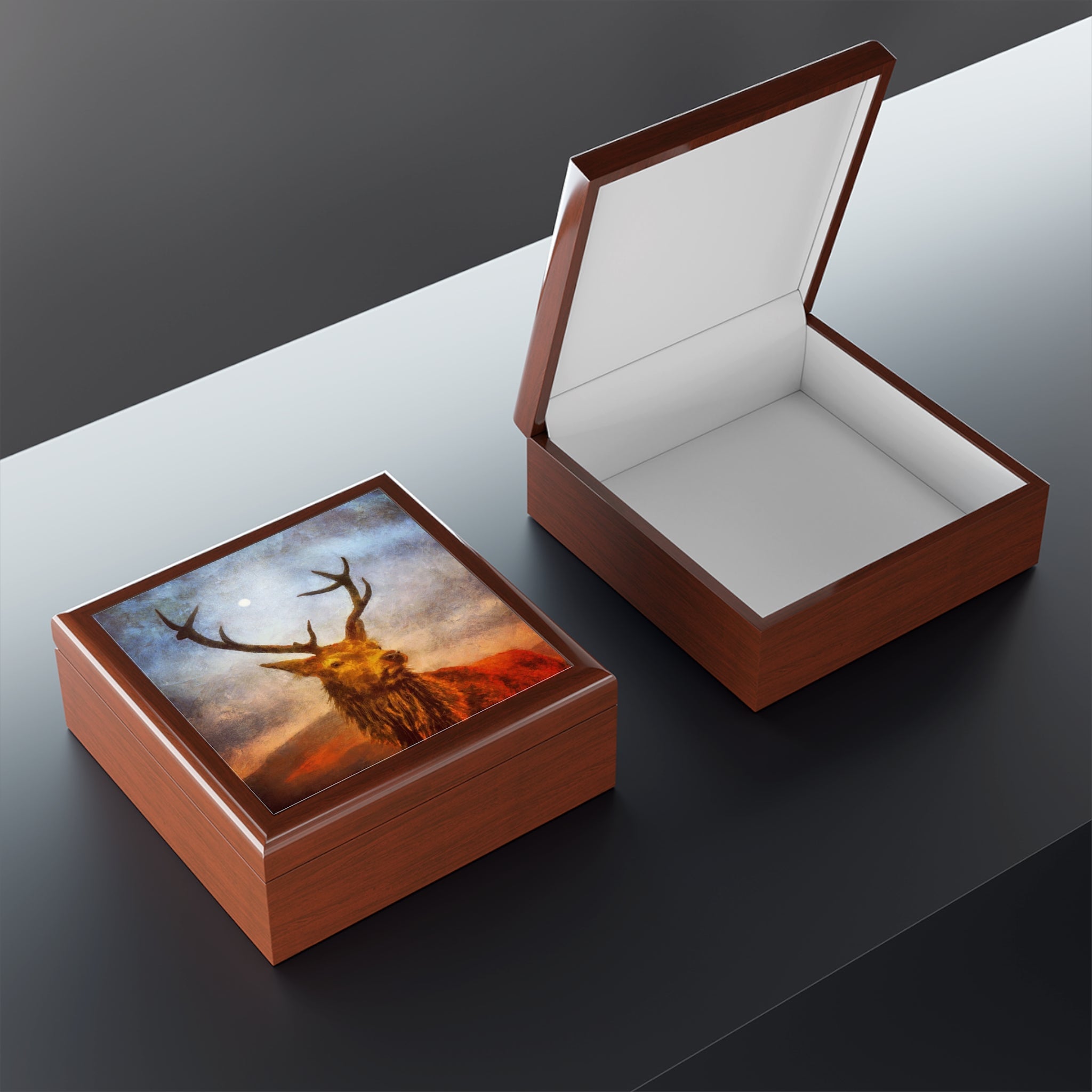 Wooden jewelry boxes featuring a Highland Stag design, one closed and one open showing white interior