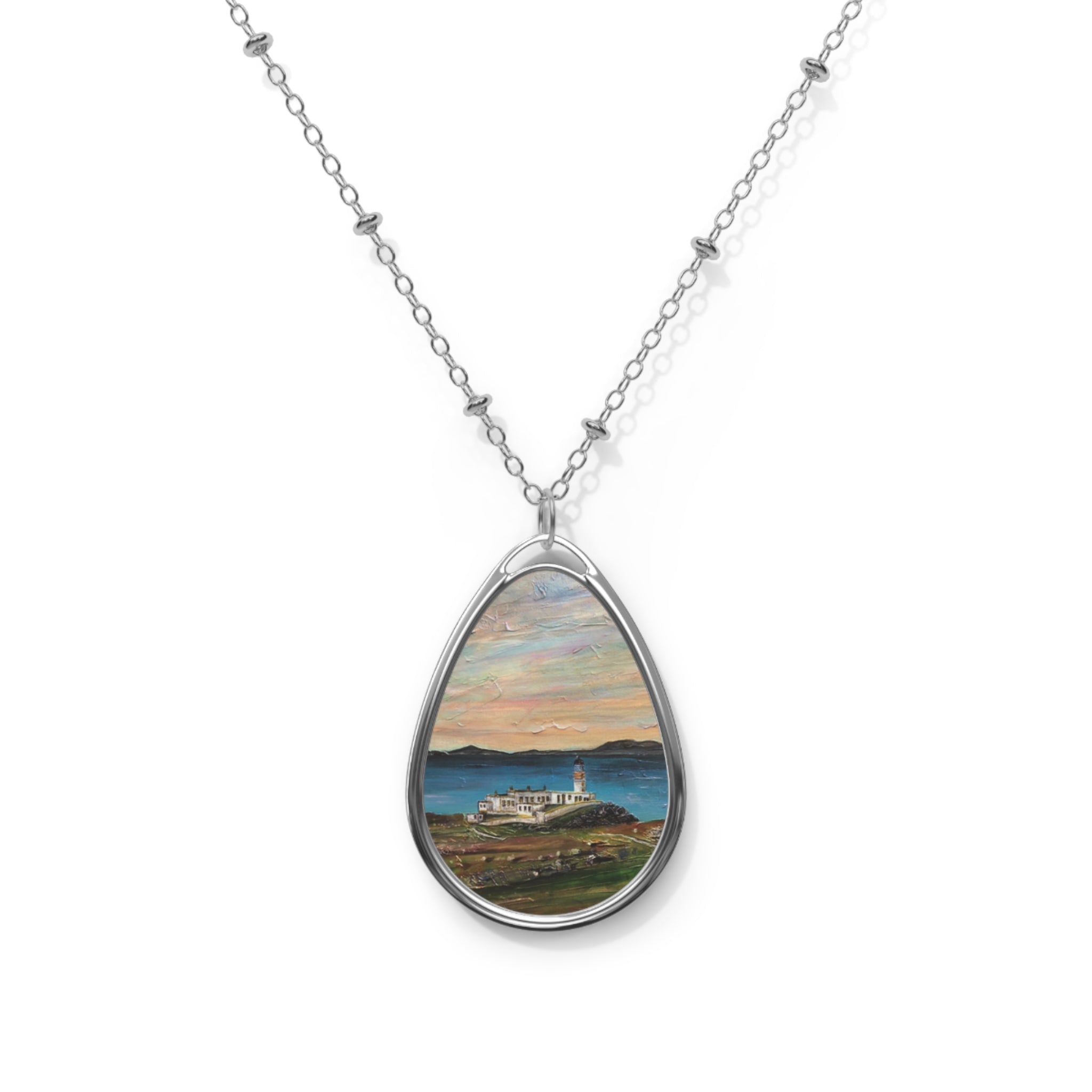 Silver Neist Point lighthouse teardrop pendant necklace at sunset