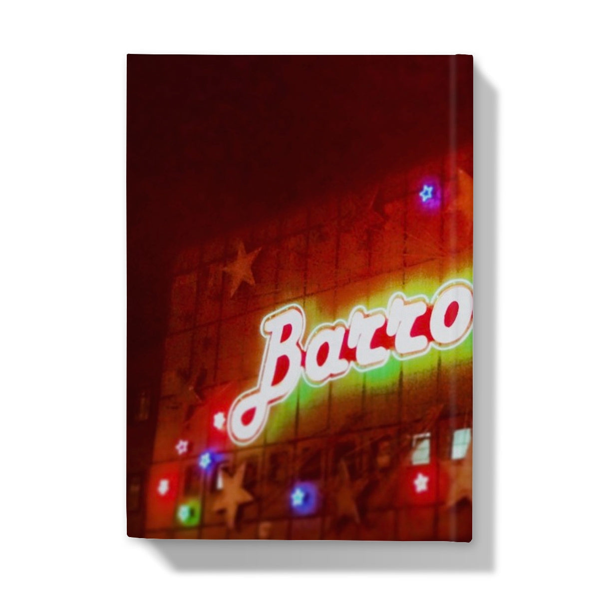Vibrant neon Barzoo sign in red, green, yellow on dark facade for Neon Glasgow Barrowlands journal