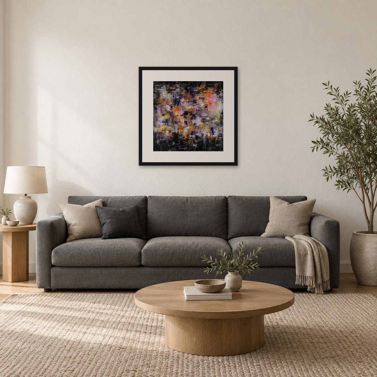 Never Is Enough 20x20 inch artist proof print framed with mount above a grey sofa, shown to scale